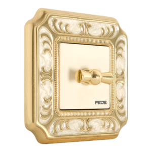 INTERRUPTOR ROTATIVO EN MARCO DE LATÓN DE LA COLECCIÓN SMALTO ITALIANO SIENA EN ORO BRILLO Y BLANCO PERLA